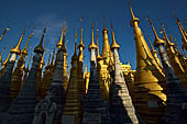 Inle Lake Myanmar. Indein, on the summit of a hill the  Shwe Inn Thein Paya a cluster of hundreds of ancient stupas. Many of them are ruined and overgrown with bushes. 